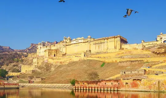 Temple on a hill above a lake in India